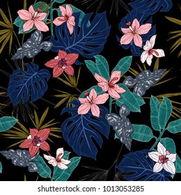 Tropical plants, flowers and leaves seamless pattern on a black background. Vector illustration.