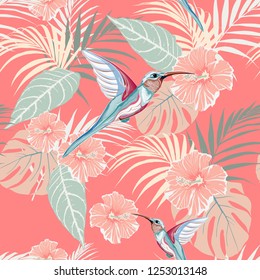 Tropical plants, hibiscus and Colibri bird. Seamless tropical pattern, bright background. Backdrop with palm monster leaves, bird and flowers.