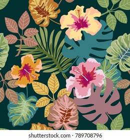 Tropical plants on dark green background. Seamless botanical pattern with aloha motifs. Trendy design for textile, cards and invitations.