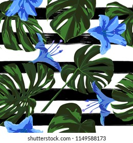 Tropical Print. Jungle Seamless Pattern. Vector Illustration of Tropical Leaves and Flowers. Interior Design
Swimwear Design. 
 
