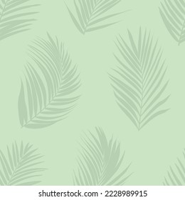 Tropical repeat pattern with palm leaves on light green background. For wallpaper, fabric and other print products.