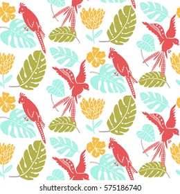 Tropical seamless background with parrots and palm leaves. Summer texture for fabric design. Trendy yellow, pink, green and blue colors.