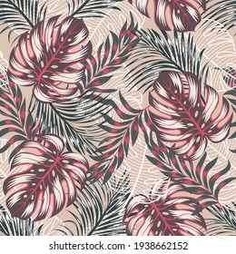 Tropical seamless fashion pattern with bright and colorful plants and leaves on a pink background. Beautiful print with hand drawn exotic plants. Seamless pattern with colorful leaves and plants.