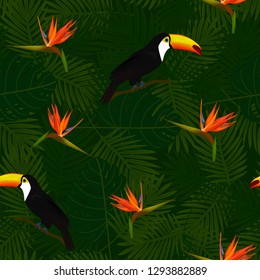 Tropical seamless pattern of bird of Paradise flowers (strelitzia) and toucans on palm leaves background. Exotic illustration of wildlife.