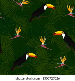 Tropical seamless pattern of bird of Paradise flowers (strelitzia) and toucans on palm leaves background. Exotic illustration of wildlife.