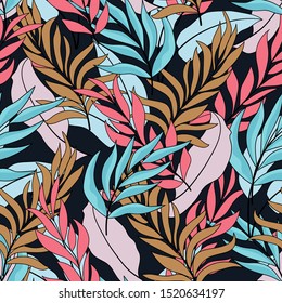 Tropical seamless pattern with bright blue and pink leaves and flowers on black background. Tropic leaves in bright colors. 
Beautiful seamless vector floral pattern.