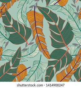 Tropical seamless pattern with bright plants and leaves on a green delicate background. Vector design. Jungle print. Textiles and printing. Floral background.