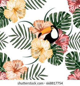 Tropical seamless pattern with colorful flowers,leafs and toucan.Summer vector background.Exotic textile texture