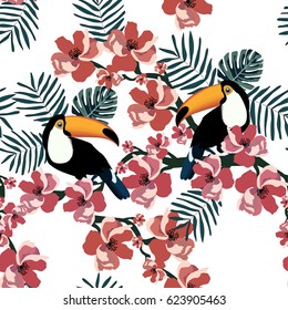 Tropical seamless pattern with colorful toucan,flower and leaf.Summer exotic background.Textile texture