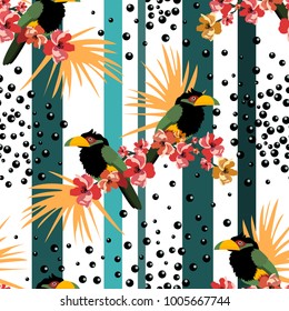 Tropical seamless pattern with colorful toucans,flowers and leafs.Vector summer background.Textile texture