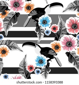 Tropical seamless pattern with colorful toucans,flowers and leafs.Summer vector background.Textile texture