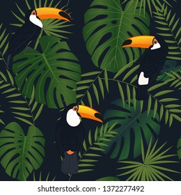 Tropical seamless pattern, exotic vector illustration. Monstera leaves and toucan birds on a black background. Fashion textile print.
