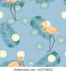 Tropical seamless pattern with flamingos, flower and citrus. Summer background with lemon, lime and flamingos. Birds of the tropics.