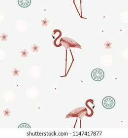 Tropical seamless pattern with flamingos, flower and citrus. Summer background with lemon, lime and flamingos. Birds of the tropics.