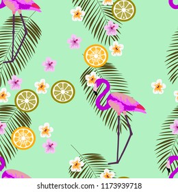 Tropical seamless pattern with flamingos, flower and citrus. Summer background with lemon, lime and flamingos. Birds of the tropics.