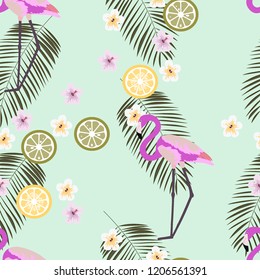 Tropical seamless pattern with flamingos, flower and citrus. Summer background with lemon, lime and flamingos. Birds of the tropics.