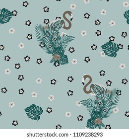 Tropical seamless pattern with flamingos, tropical leaves and hibiscus flowers. Leaves of palm, monstera and banana. Summer background with flamingos.