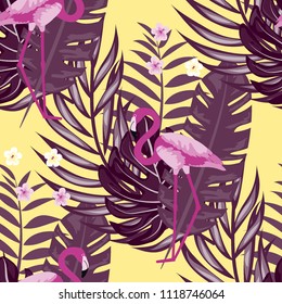 Tropical seamless pattern with flamingos, tropical leaves and hibiscus flowers. Leaves of palm, monstera and banana. Summer background with flamingos.