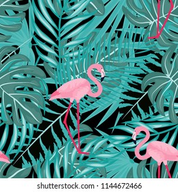 Tropical seamless pattern with flamingos, tropical leaves. Leaves of palm, monstera and banana. Summer background with flamingos.