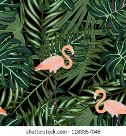Tropical seamless pattern with flamingos and tropical leaves. Leaves of palm, monstera and banana. Summer background with flamingos.