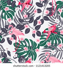 Tropical seamless pattern with flamingos and a parrot. Tropical birds. Summer floral background with tropical plants for covers, wallpaper, paper.