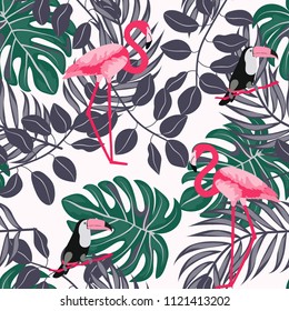 Tropical seamless pattern with flamingos and a toucan. Tropical birds. Summer floral background with tropical plants for covers, wallpaper, paper.