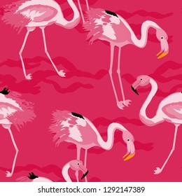Tropical seamless pattern with flamingos.Summer background with bird. Exotic seamless pattern with pink flamingo.