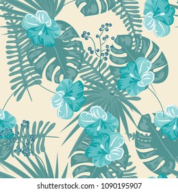 Tropical seamless pattern tropical with flowers and tropical leaves in blue.