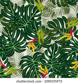 Tropical seamless pattern with flowers and leaves in a green color.