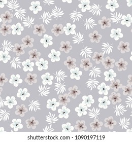 Tropical seamless pattern with flowers and leaves of tropical plants on a beige background.