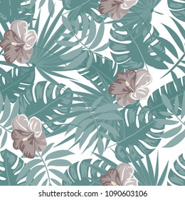 Tropical seamless pattern with flowers and leaves in a green color.
