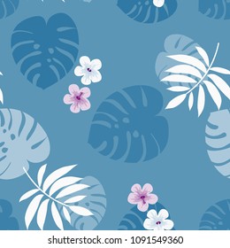 Tropical seamless pattern with flowers and leaves on a blue background. Jungle.Tropical forest. Background with tropical plants.
