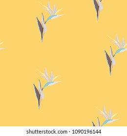 Tropical seamless pattern with flowers of strelitzia on orange background