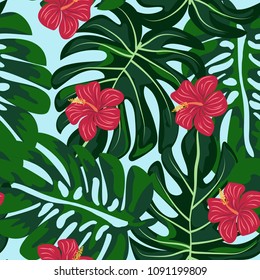 Tropical seamless pattern with green leaves and flowers. Monstera and hibiscus.