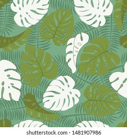 Tropical seamless pattern with green and white leaves on green background. Abstract vector illustration. Jungle print background. Great design for any purposes.