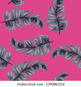 Tropical seamless pattern with indigo banana leaves on blue background. Floral background with exotic leaves.