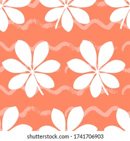 Tropical seamless pattern with large leaves on orange background. Vector illustration of summer. Exotic wallpaper with waves lines. For web, banners, scrapbooking, printing on fabric, wrapping paper.