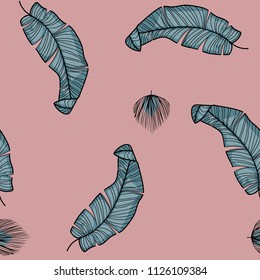 Tropical seamless pattern with leaves. Beautiful tropical isolated leaves. Fashionable summer background with leaves for fabric, wallpaper, paper, covers.