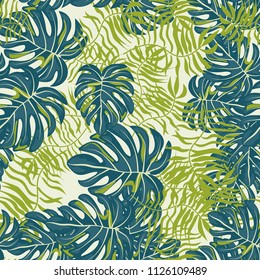 Tropical seamless pattern with leaves. Beautiful tropical isolated leaves. Fashionable summer background with leaves for fabric, wallpaper, paper, covers.