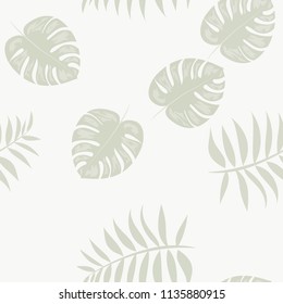 Tropical seamless pattern with leaves. Beautiful tropical isolated leaves. Fashionable summer background with leaves for fabric, wallpaper, paper, covers.