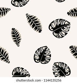 Tropical seamless pattern with leaves. Beautiful tropical isolated leaves. Fashionable summer background with leaves for fabric, wallpaper, paper, covers.