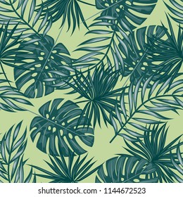 Tropical seamless pattern with leaves. Beautiful tropical isolated leaves. Fashionable summer background with leaves for fabric, wallpaper, paper, covers.