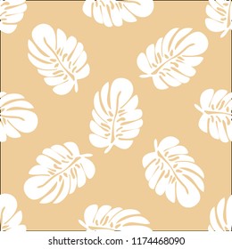 Tropical seamless pattern with leaves. Beautiful tropical isolated leaves. Fashionable summer background with leaves for fabric, wallpaper, paper, covers.