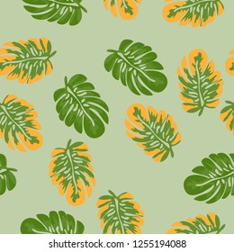 Tropical seamless pattern with leaves. Beautiful tropical isolated leaves. Fashionable summer background with leaves for fabric, wallpaper, paper, covers.