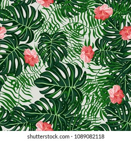 Tropical seamless pattern with leaves and flowers. Pattern with flowers. Hibiscus, monstera, palm.