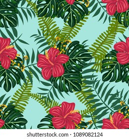 Tropical seamless pattern with leaves and flowers. Pattern with flowers. Hibiscus, monstera, palm.