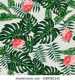 Tropical seamless pattern with leaves and flowers. Pattern with flowers. Hibiscus, monstera, palm.