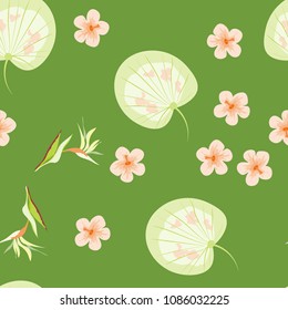 Tropical seamless pattern with leaves of a palm tree, flowers of strelitzia and hibiscus.