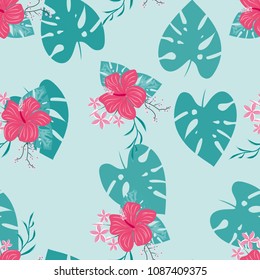 Tropical seamless pattern with leaves of a palm tree, flowers of strelitzia and hibiscus.