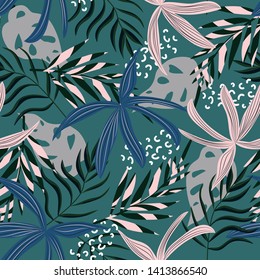 Tropical seamless pattern with leaves and plants on a dark background. Vector design. Jungle print. Textiles and printing.